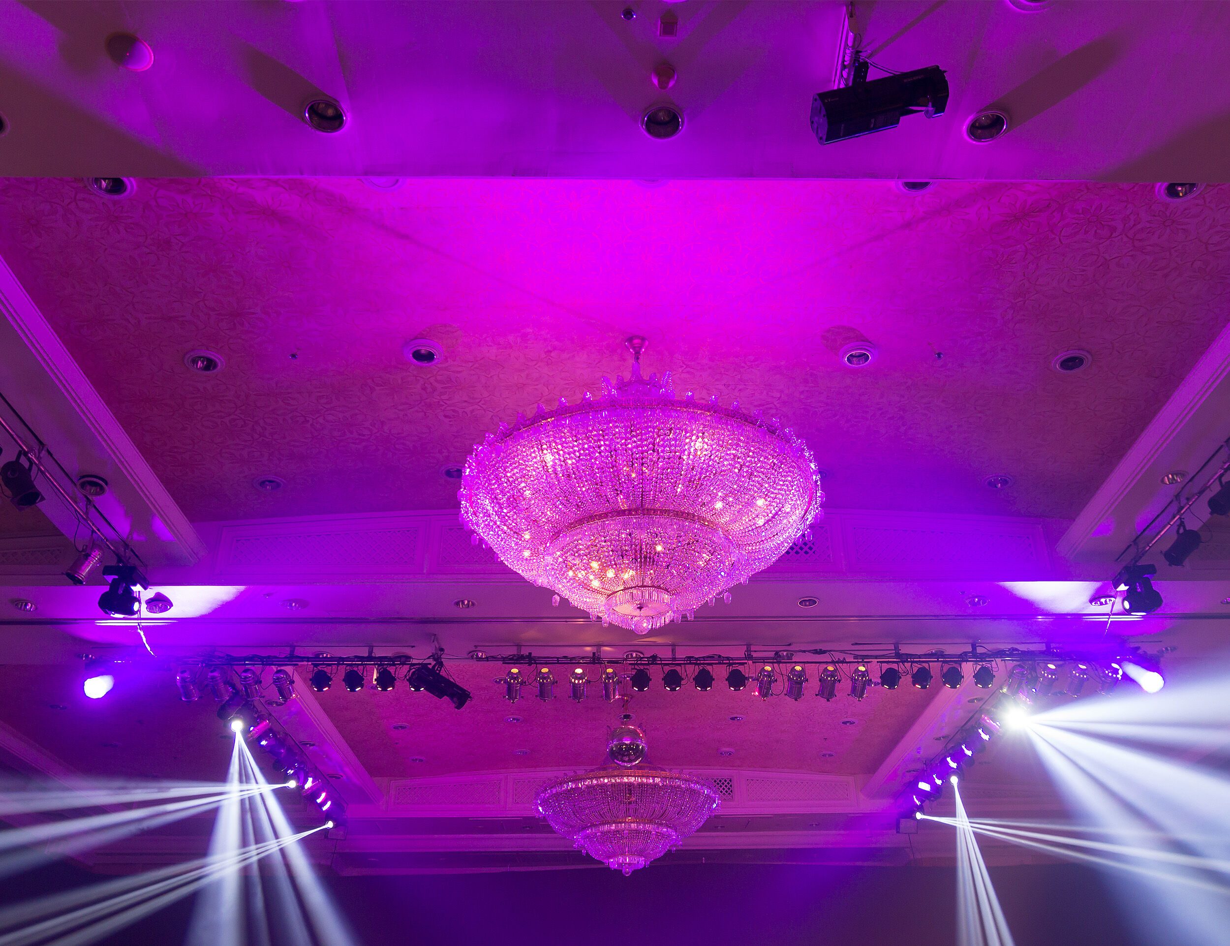 Stunning colorful chandelier (jhoomar) adding elegance to the Sangeet ceremony decor.